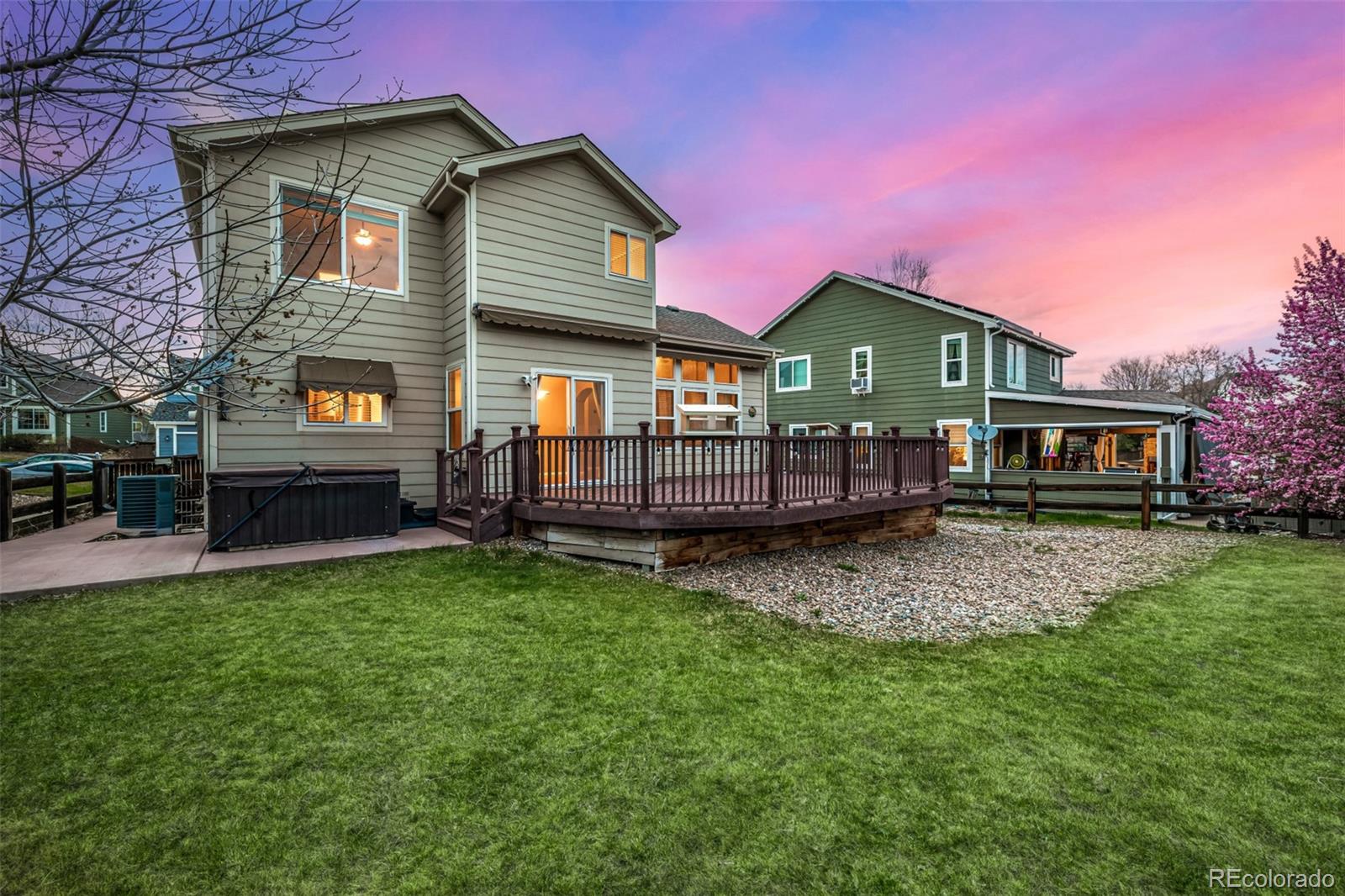 10244 Royal Eagle Street Highlands Ranch, CO 80129 - Photo 40 of 46 a front view of a house with a garden and deck