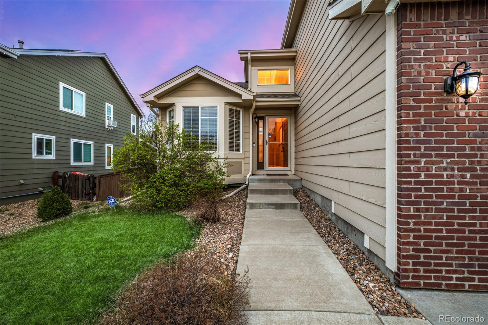 10244 Royal Eagle Street Highlands Ranch, CO 80129 - Photo 4 of 46 a front view of a house with garden