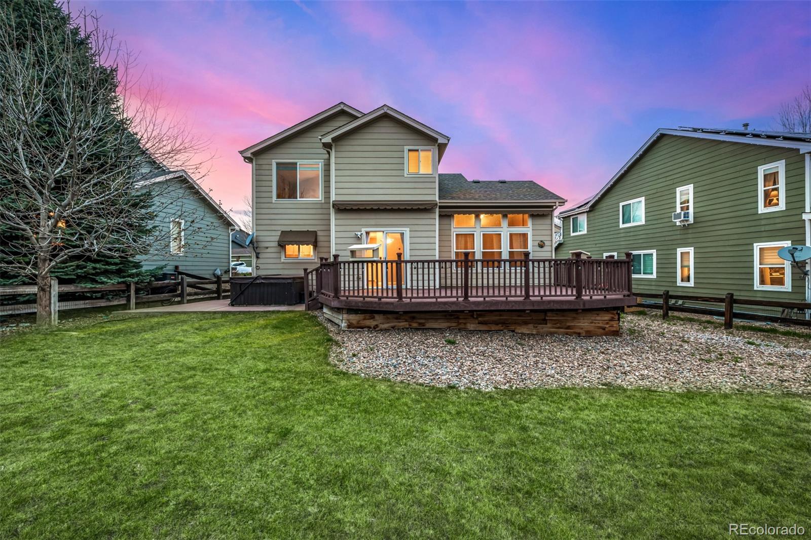 10244 Royal Eagle Street Highlands Ranch, CO 80129 - Photo 41 of 46 a front view of a house with a yard