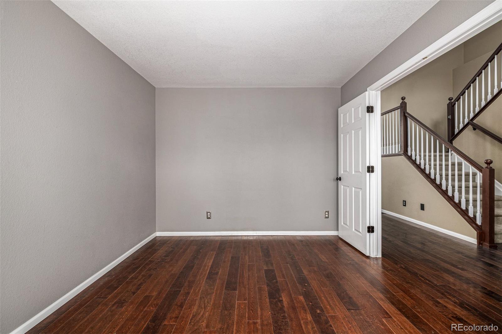 10244 Royal Eagle Street Highlands Ranch, CO 80129 - Photo 8 of 46 a view of room with wooden floor