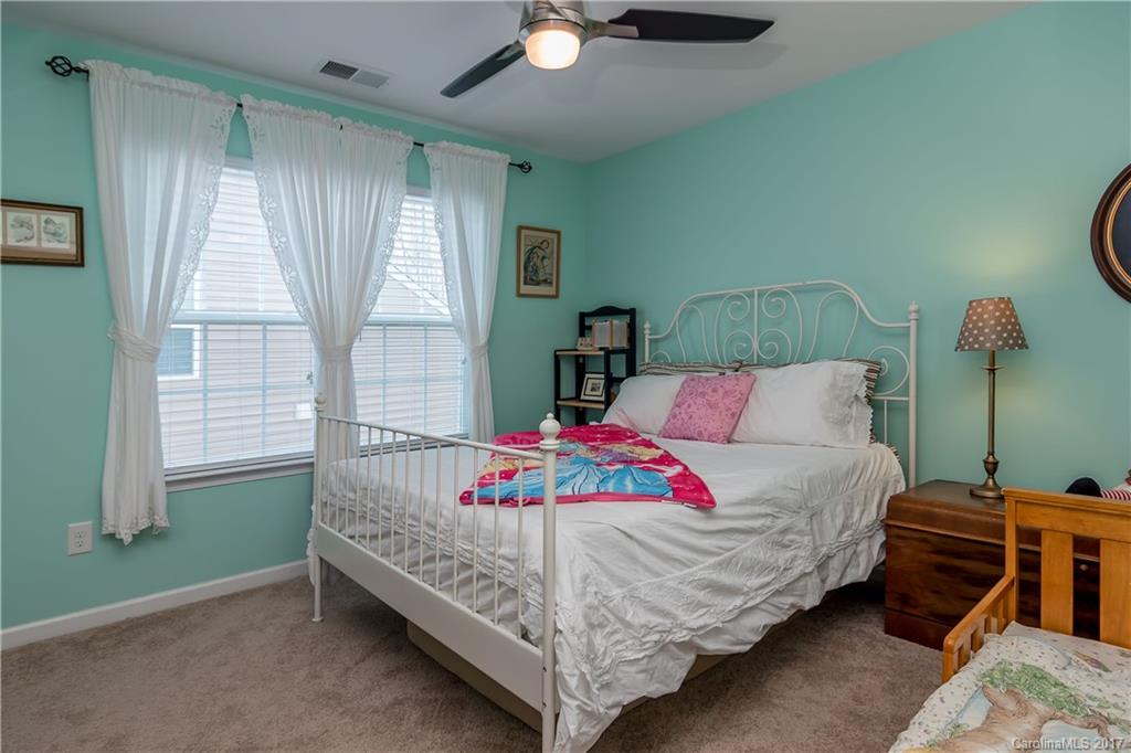 4229 Perth Road, Unit 10 Indian Land, SC 29707 - Photo 22 of 24 a white bed sitting in a bedroom next to a window