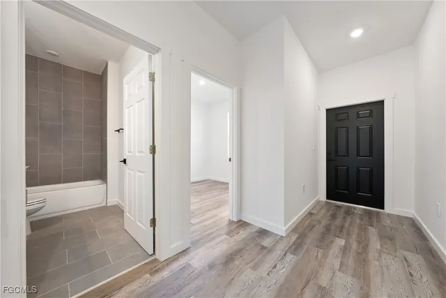 a view of a bathroom with wooden floor