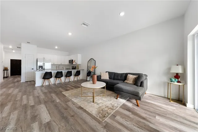 a living room with furniture and a table