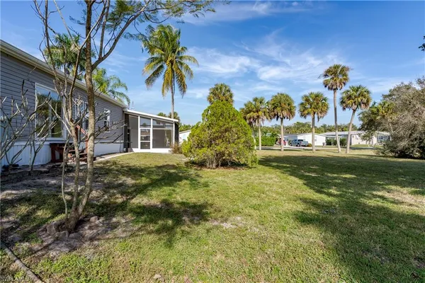 a view of a house with a yard
