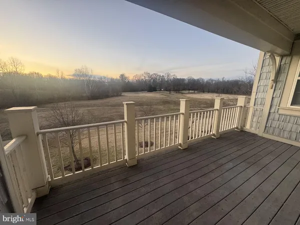 a view of balcony with wooden floor