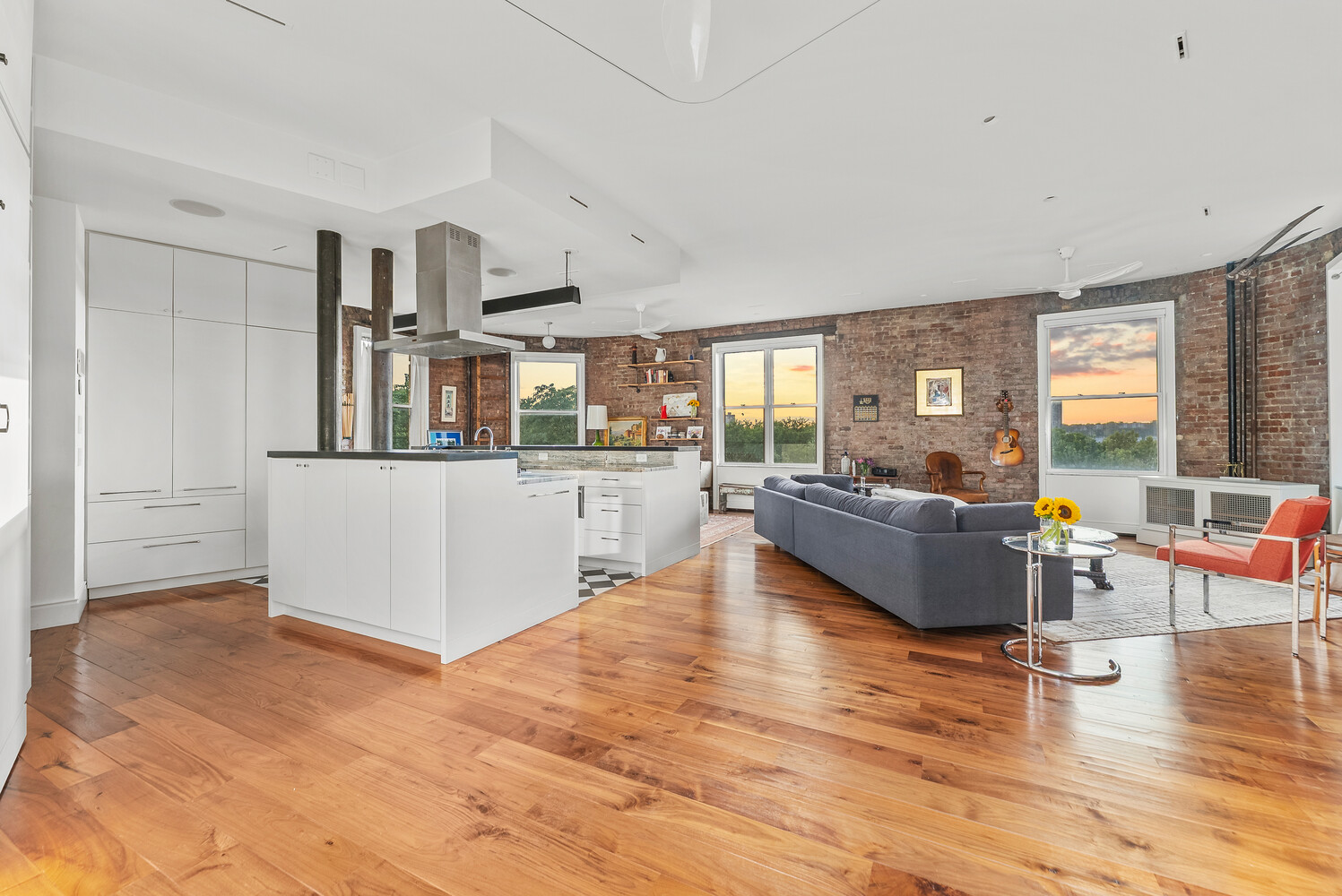 214 Riverside Drive, Unit 508/509 Manhattan, NY 10025 - Photo 1 of 17 a living room with furniture and a large window