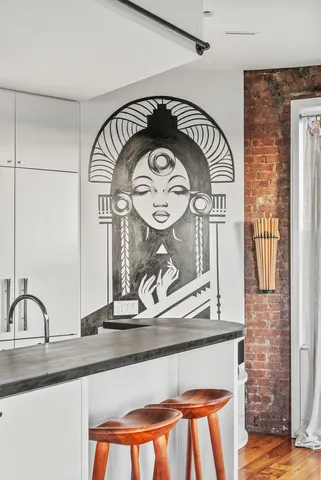 a bathroom with a granite countertop sink and a large mirror