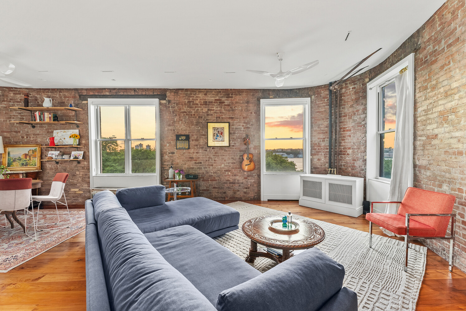 214 Riverside Drive, Unit 508/509 Manhattan, NY 10025 - Photo 5 of 17 a living room with furniture and a large window