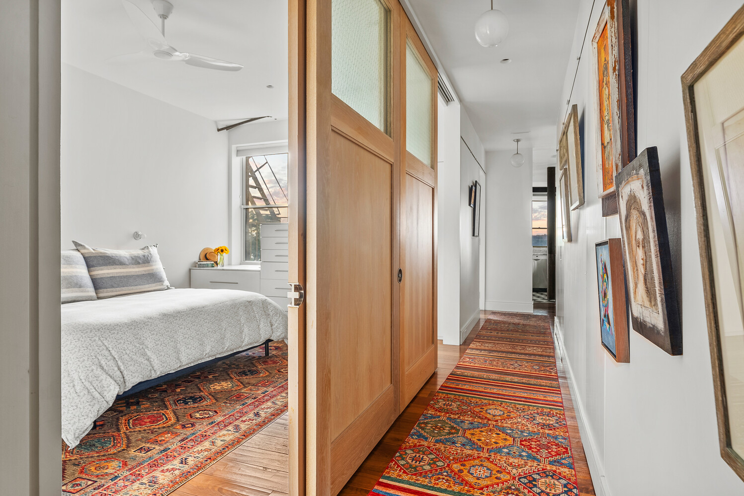 214 Riverside Drive, Unit 508/509 Manhattan, NY 10025 - Photo 6 of 17 a hallway with a furniture and a rug