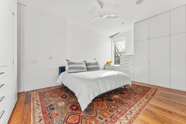 a hallway with a furniture and a rug
