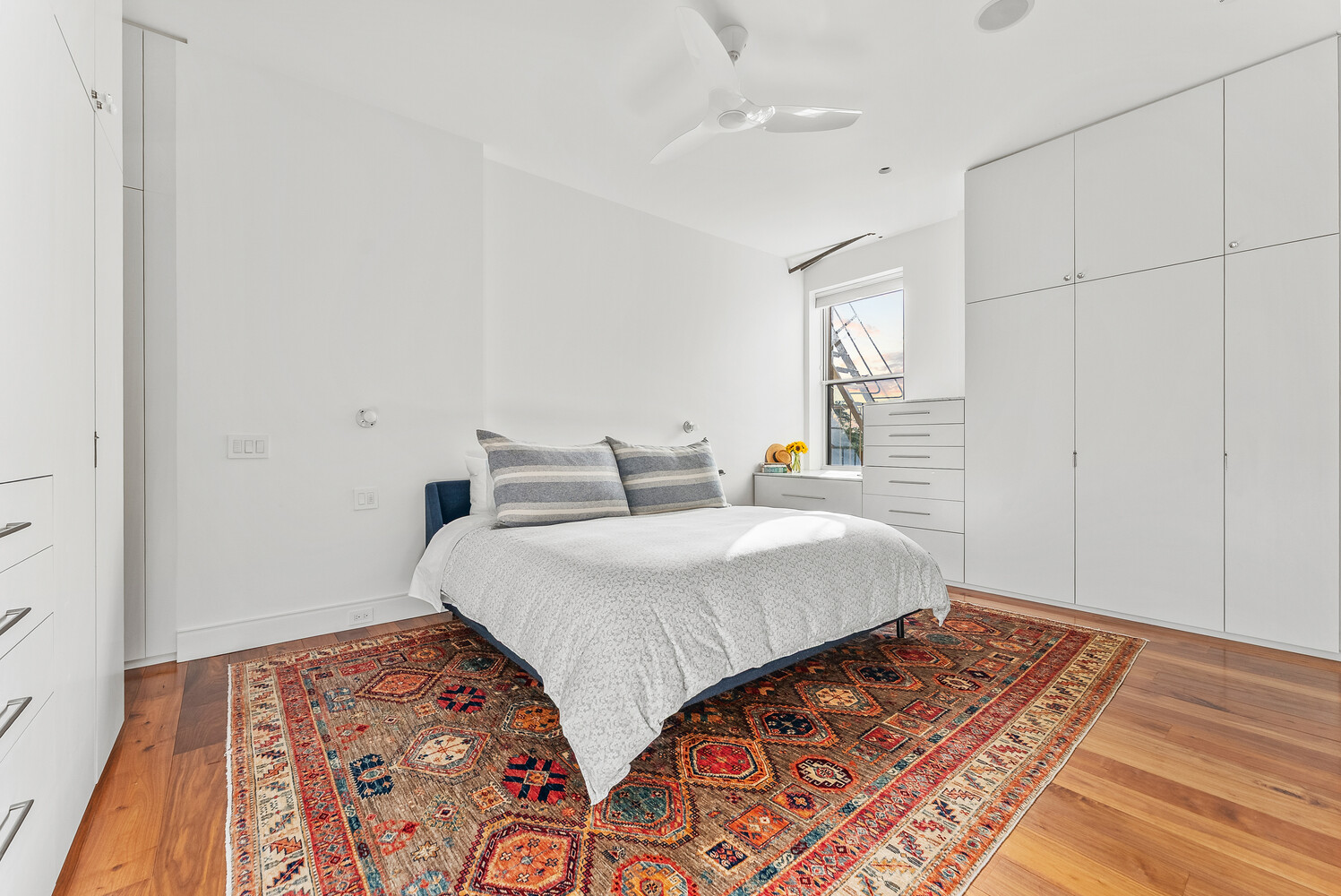 214 Riverside Drive, Unit 508/509 Manhattan, NY 10025 - Photo 7 of 17 a bedroom with a bed and wooden floor