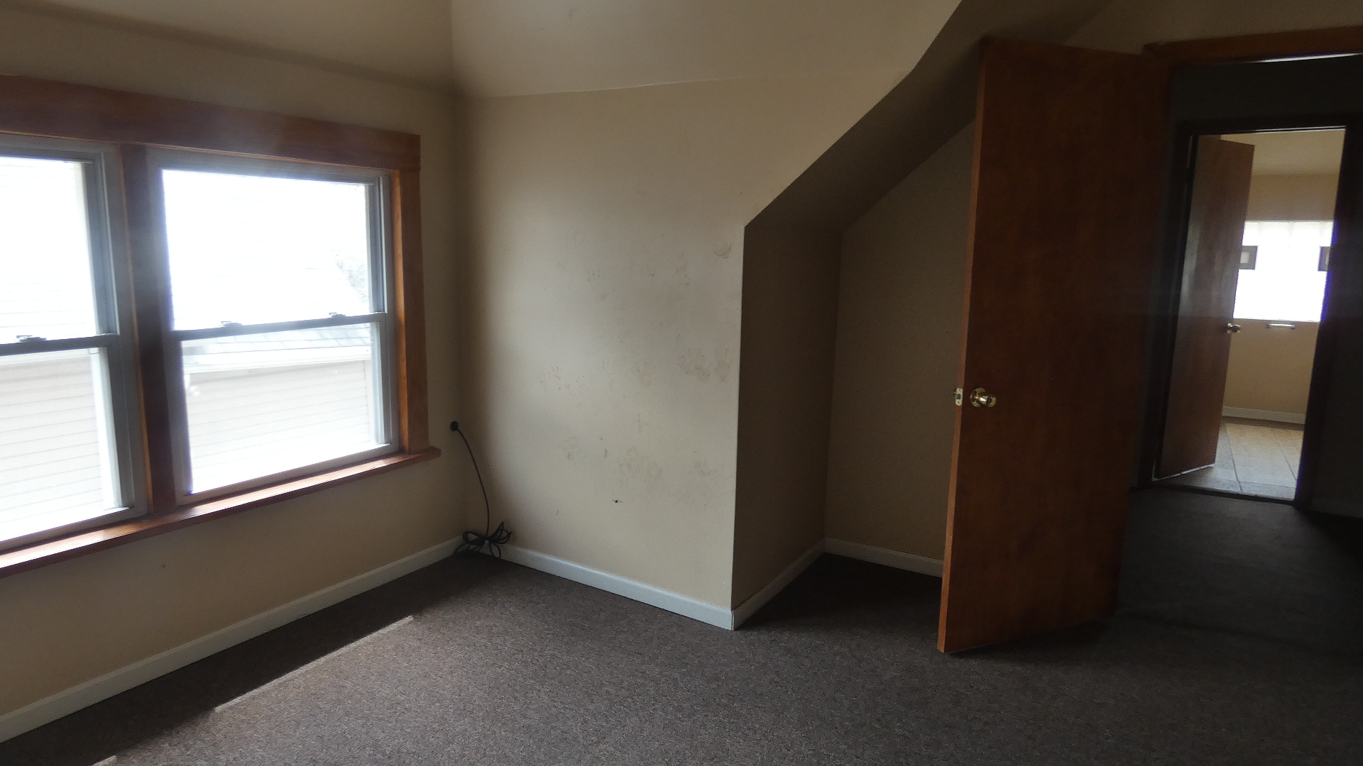 Undisclosed Address Chicago, IL 60628 - Photo 12 of 20 an empty room with wooden floor and windows