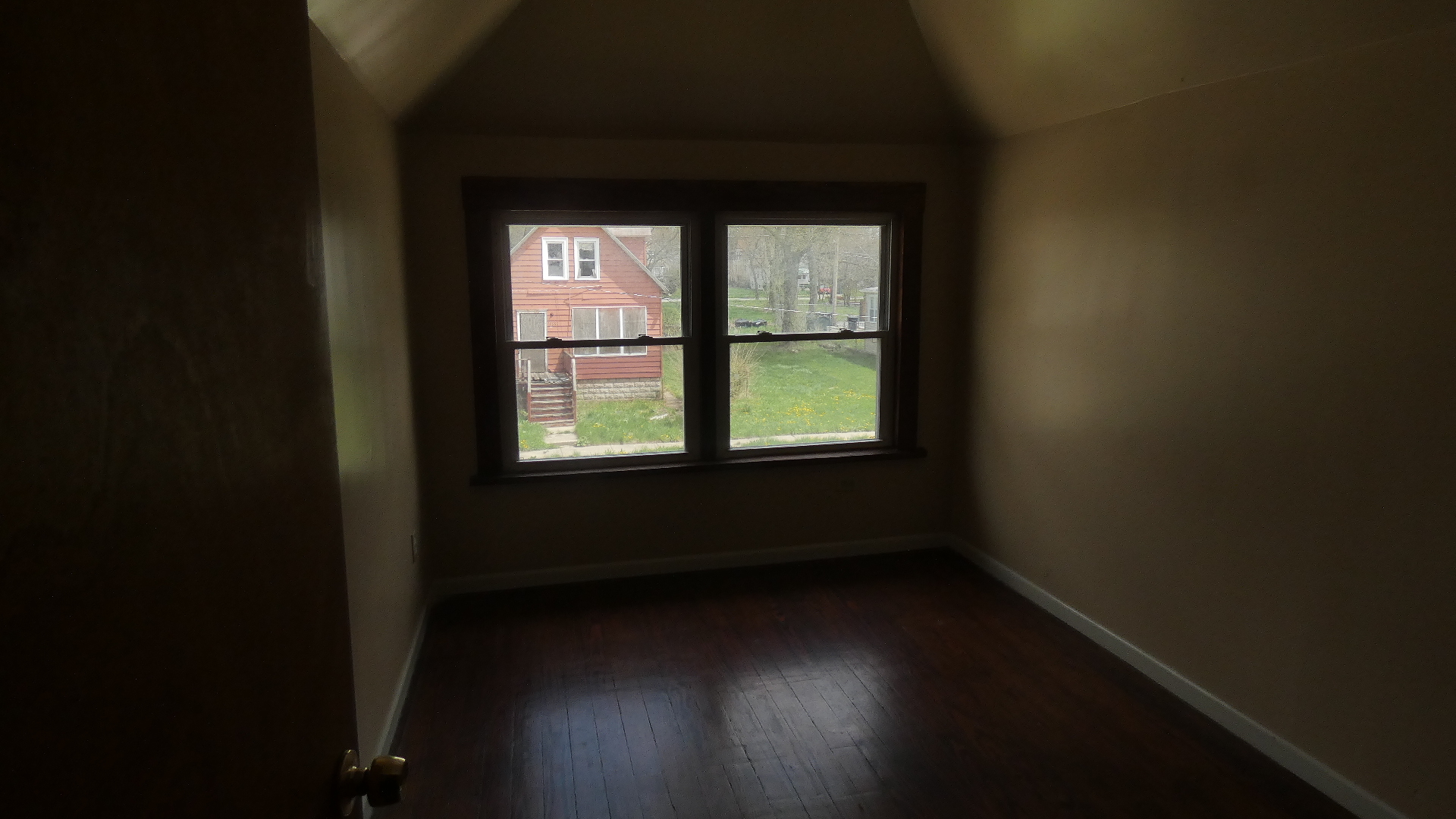 Undisclosed Address Chicago, IL 60628 - Photo 14 of 20 a view of a hallway with wooden floor and a window