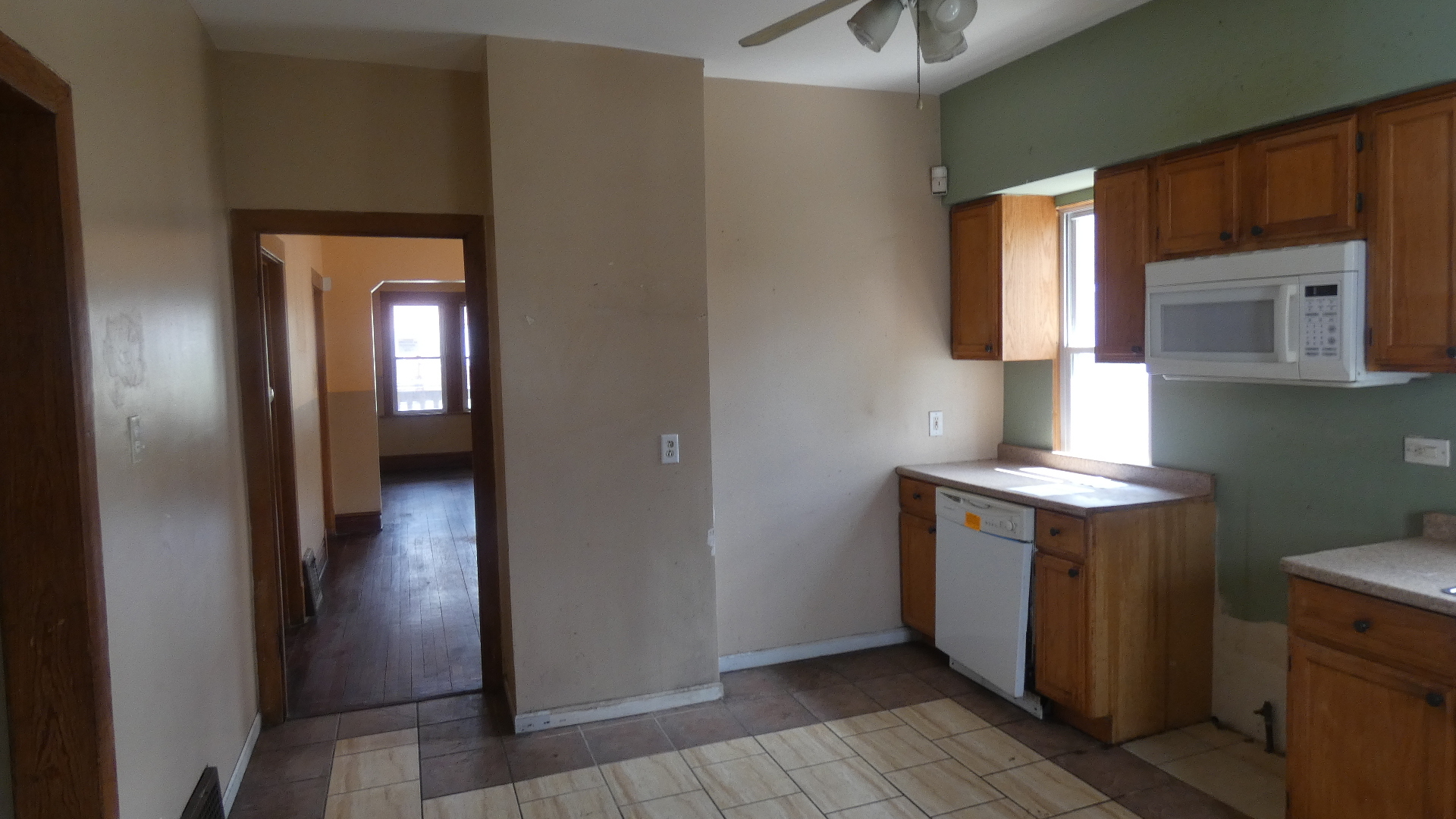 Undisclosed Address Chicago, IL 60628 - Photo 7 of 20 a hallway with washer and dryer