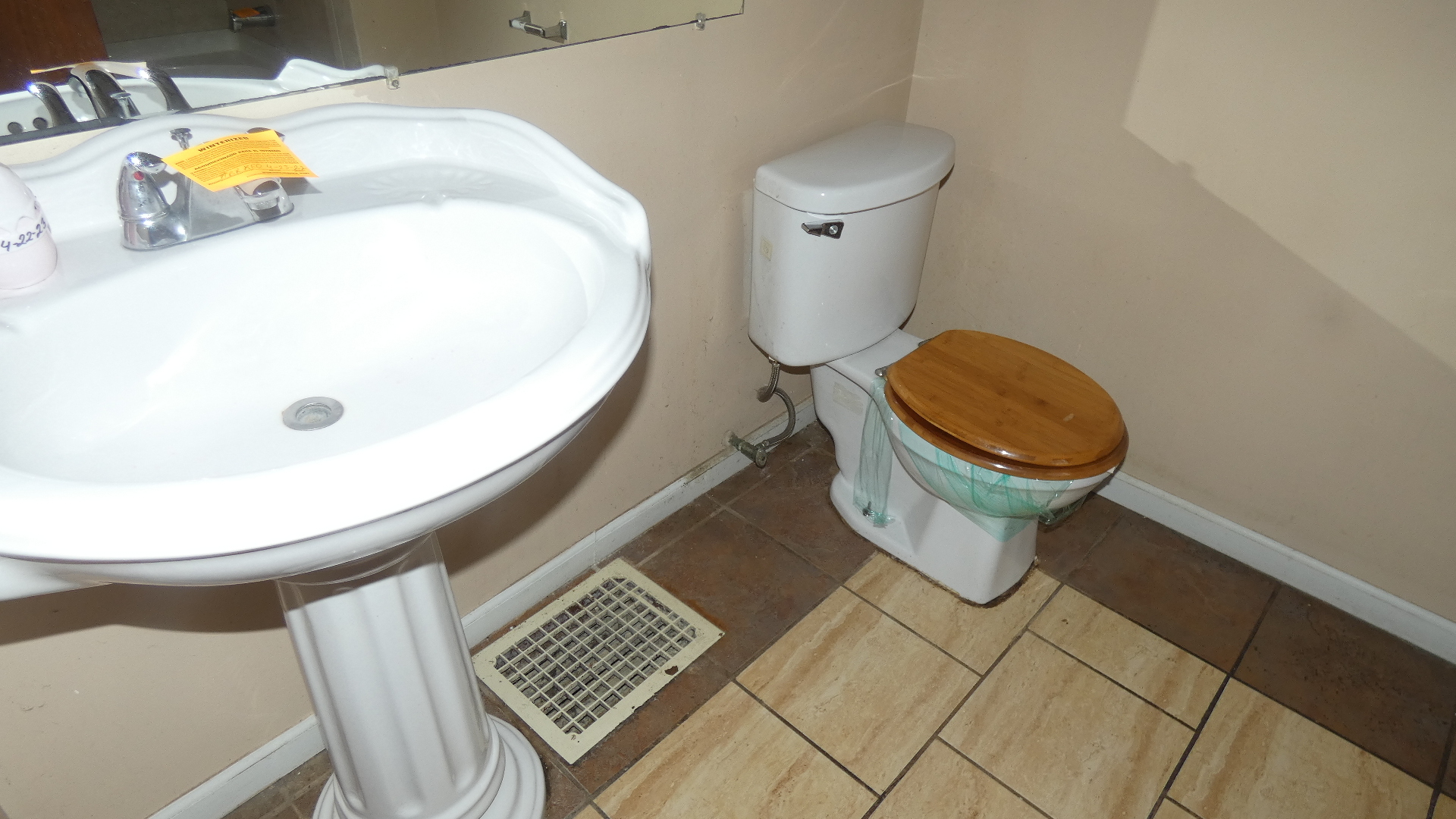 Undisclosed Address Chicago, IL 60628 - Photo 8 of 20 a close view of a sink and a toilet in a bathroom