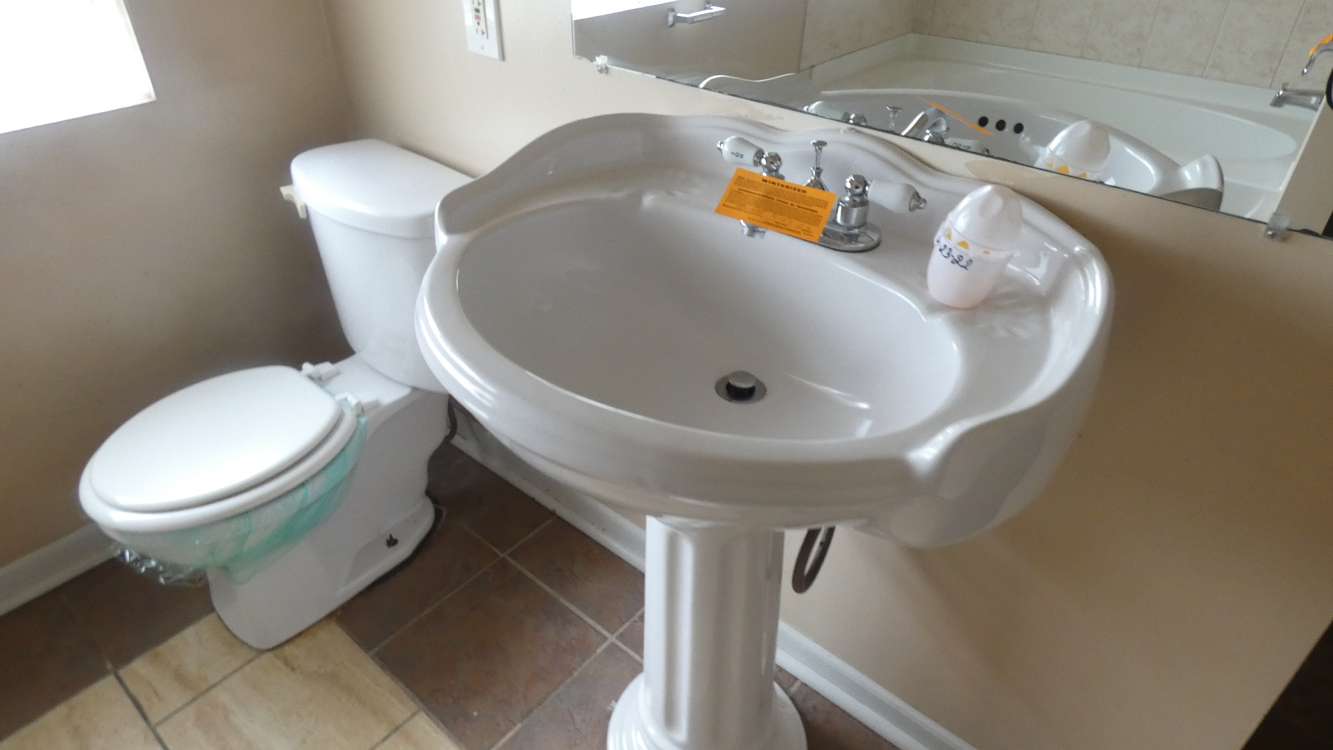 Undisclosed Address Chicago, IL 60628 - Photo 10 of 20 a bathroom with a toilet and a sink