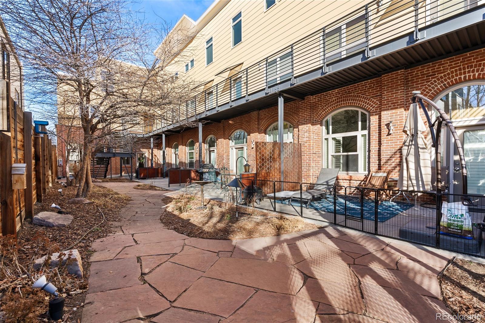 2501 Grove Street, Unit 101 Denver, CO 80211 - Photo 31 of 37 a view of a building with sitting area