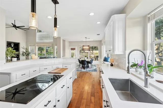 a kitchen with a sink and cabinets