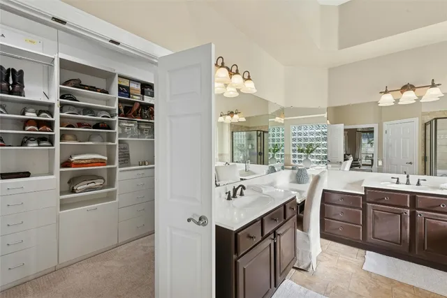 a bedroom with a bed window and a desk