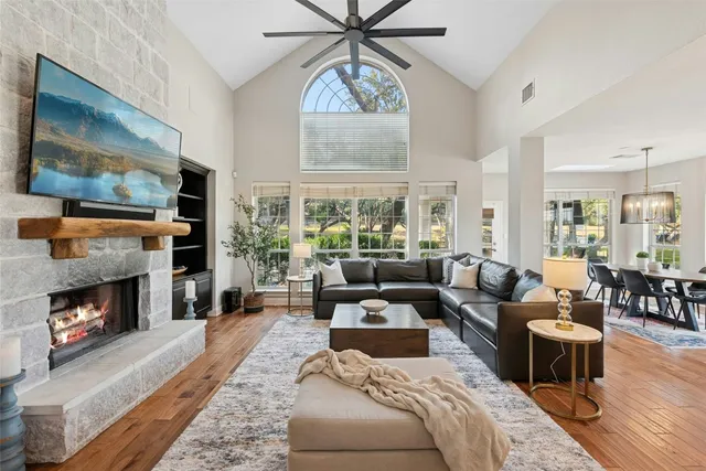 a living room with furniture and a fireplace