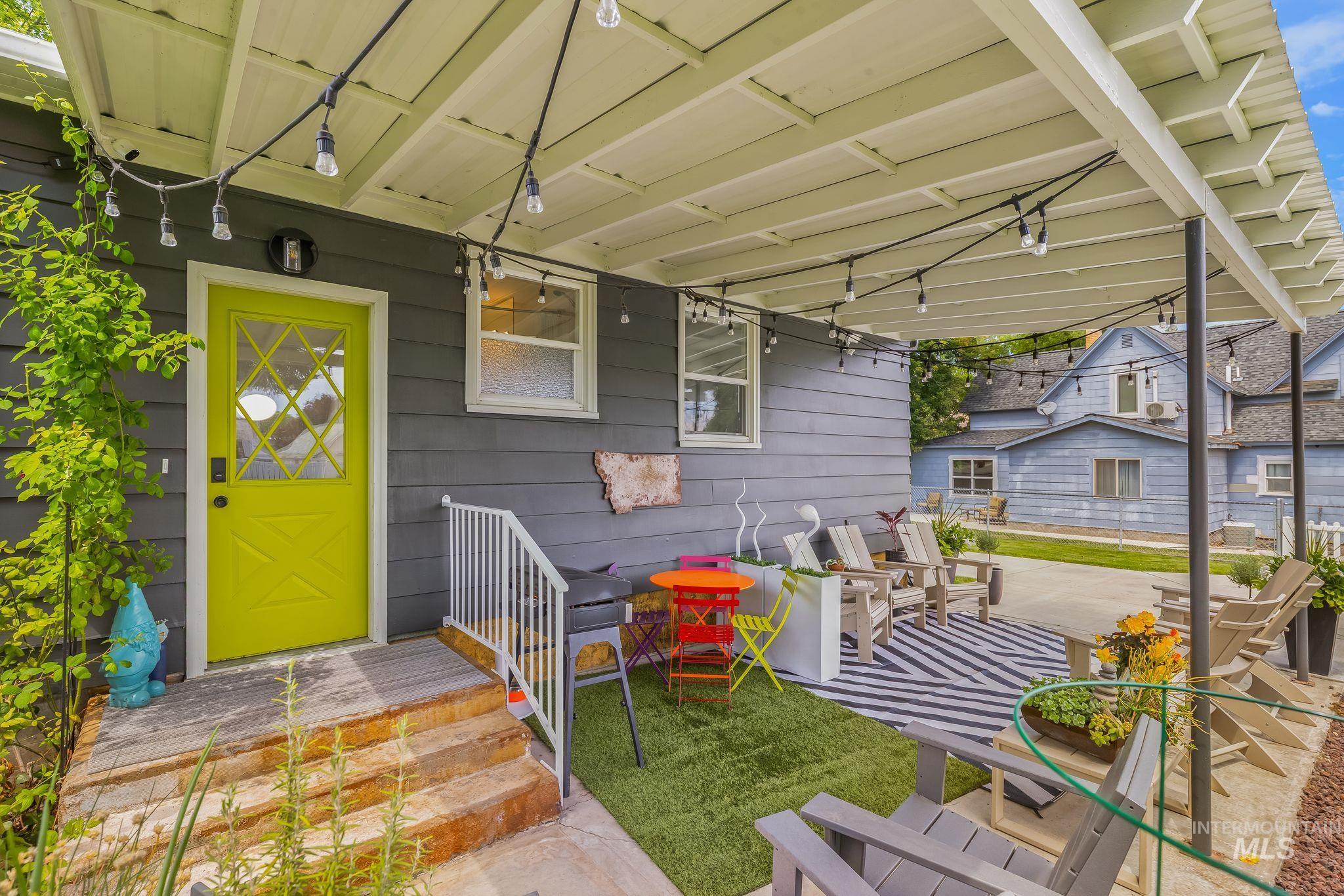 1315 8th Street Clarkston, WA 99403 - Photo 34 of 37 Covered patio featuring string lighting and a durable flat roof
