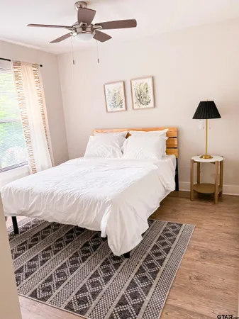 a large white bed in a white room