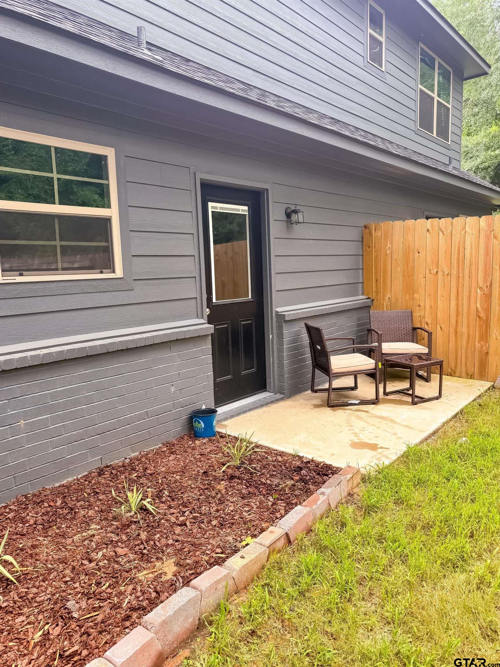 11722 Fm 16, Unit A Lindale, TX 75771 - Photo 16 of 17 a view of back yard of the house
