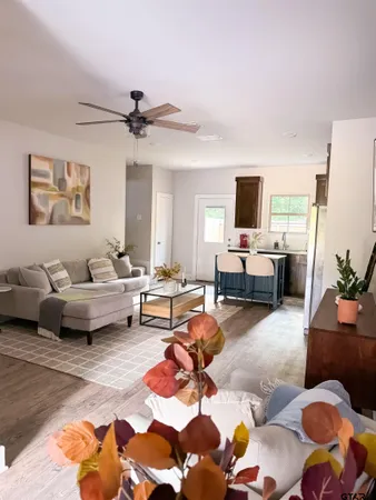 a living room with furniture and a rug