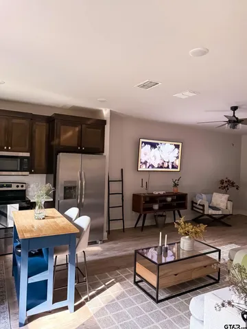 a bedroom with a bed and a couch