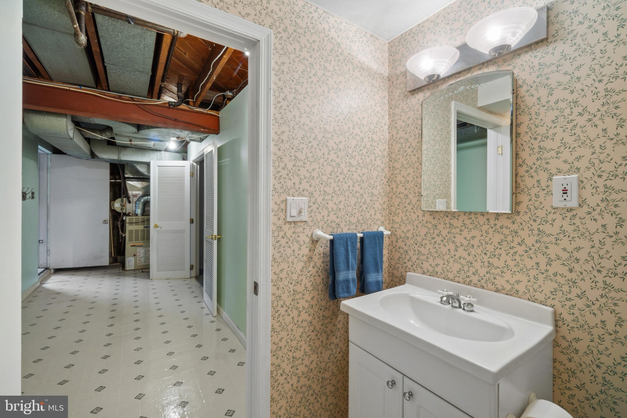 909 Weatherbee Road Towson, MD 21286 - Photo 46 of 51 a bathroom with a sink a toilet and shower