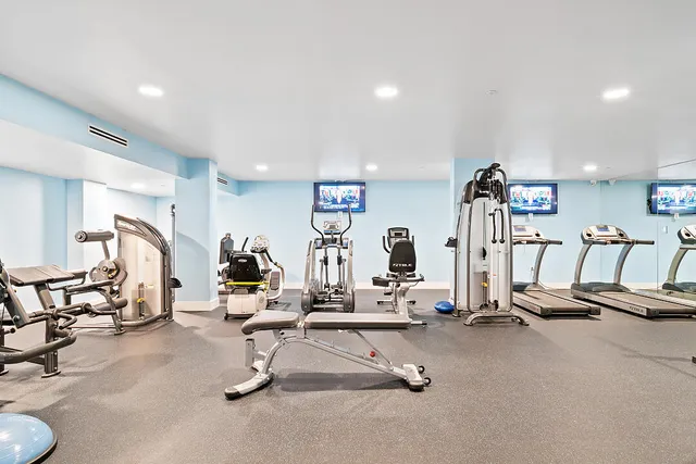 a view of a patio with a table chairs and a garden