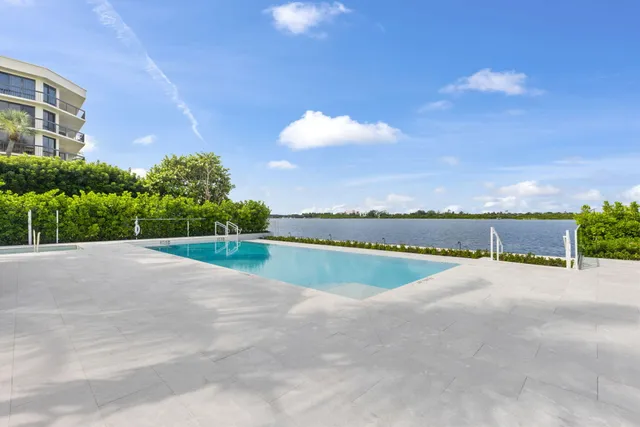 a view of a patio with couches and potted plants