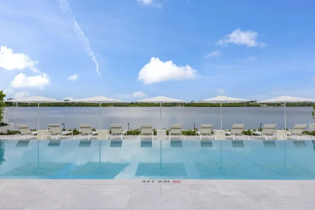 a view of swimming pool with outdoor space and seating area