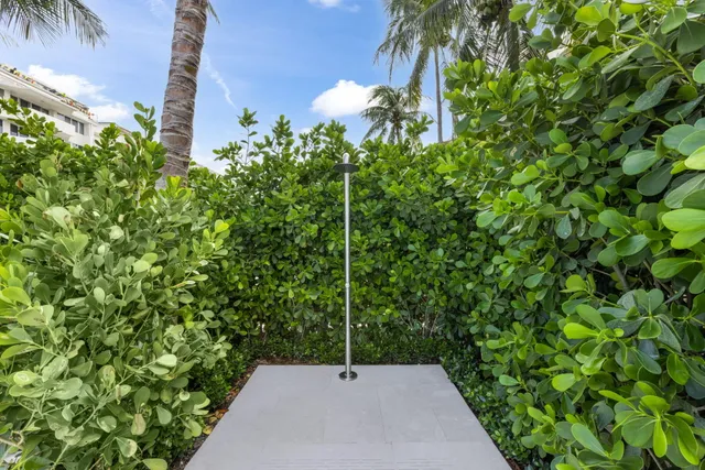 a large kitchen with a sink and cabinets