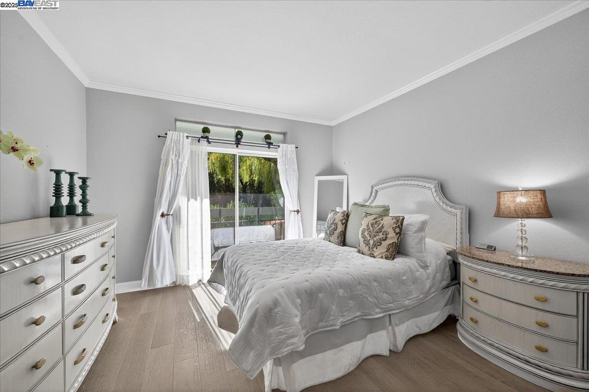 7875 Canyon Meadows Circle, Unit C Pleasanton, CA 94588 - Photo 20 of 32 a bedroom with a bed and a dresser