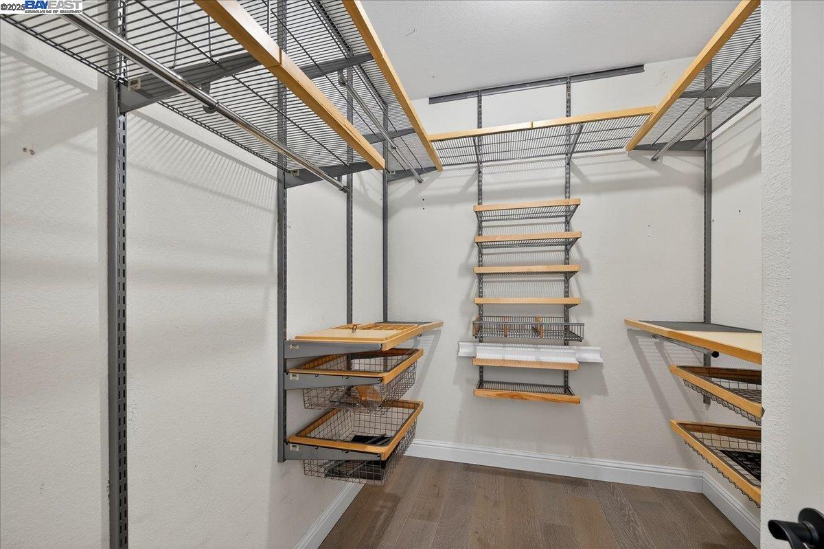 7875 Canyon Meadows Circle, Unit C Pleasanton, CA 94588 - Photo 21 of 32 a view of walk in closet with empty racks