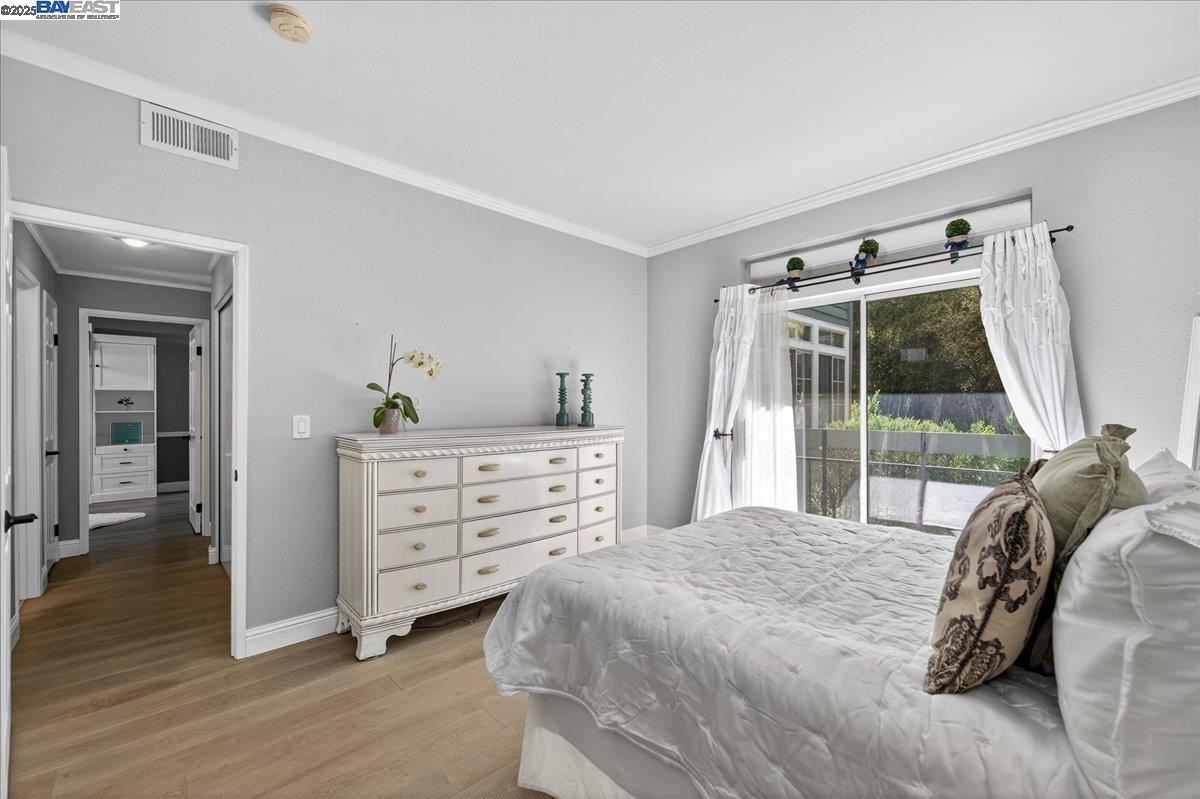 7875 Canyon Meadows Circle, Unit C Pleasanton, CA 94588 - Photo 23 of 32 a bedroom with a bed and a window