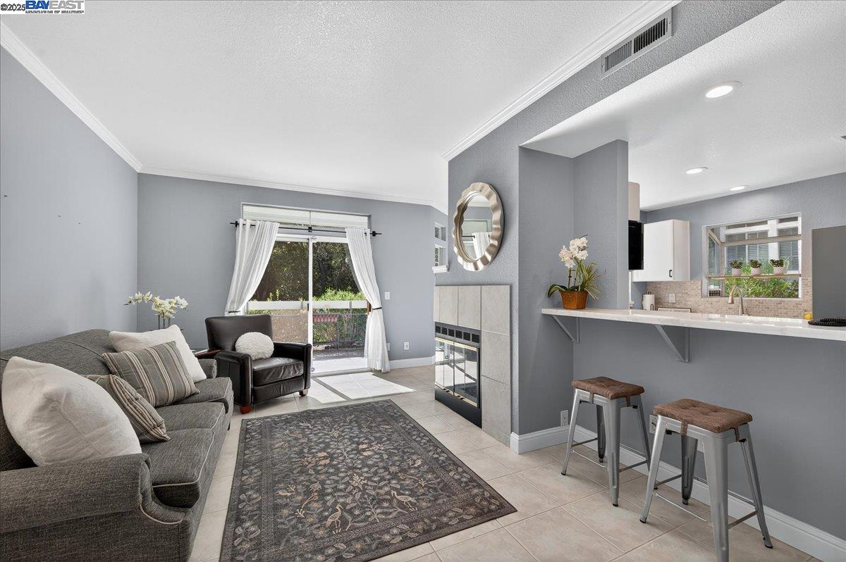 7875 Canyon Meadows Circle, Unit C Pleasanton, CA 94588 - Photo 3 of 32 a living room with furniture and a large window