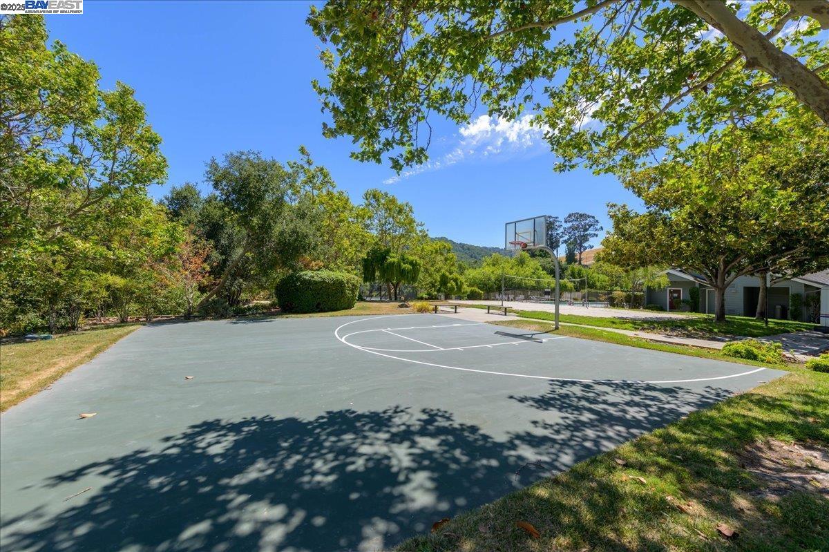 7875 Canyon Meadows Circle, Unit C Pleasanton, CA 94588 - Photo 31 of 32 a view of a swimming pool with a yard