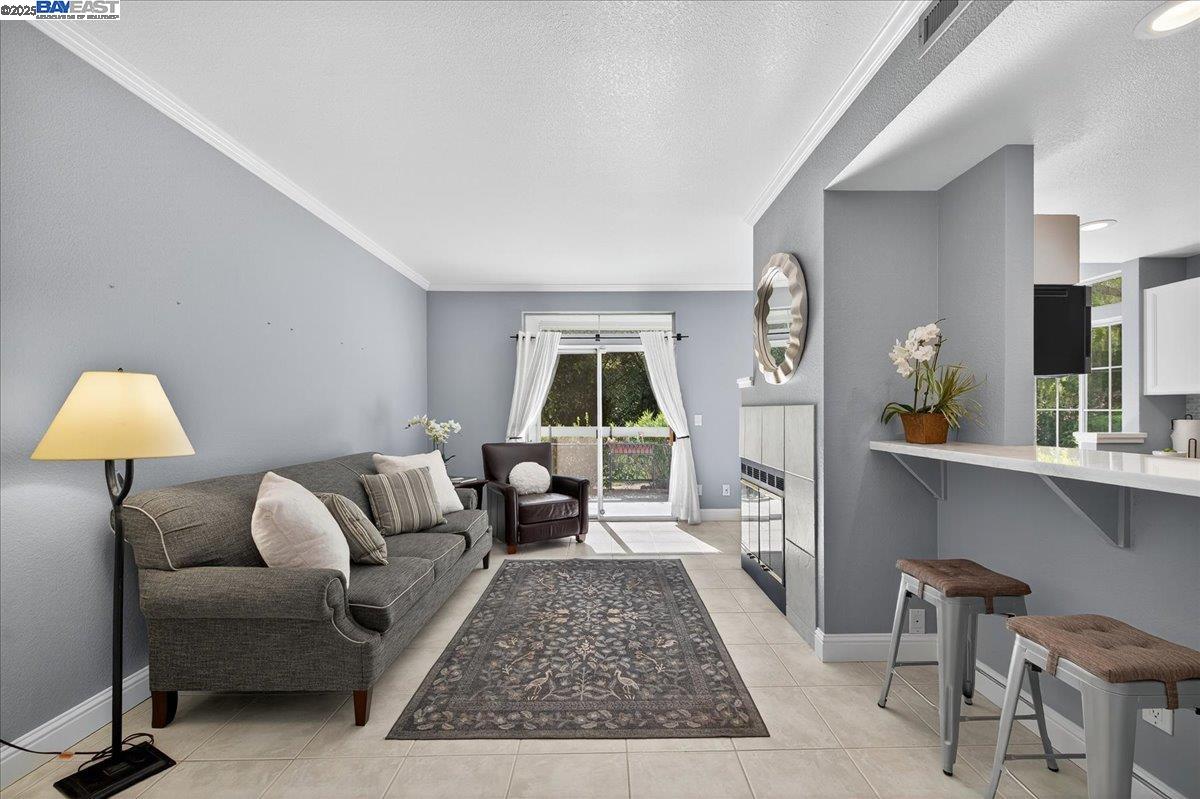 7875 Canyon Meadows Circle, Unit C Pleasanton, CA 94588 - Photo 4 of 32 a living room with furniture and a large window