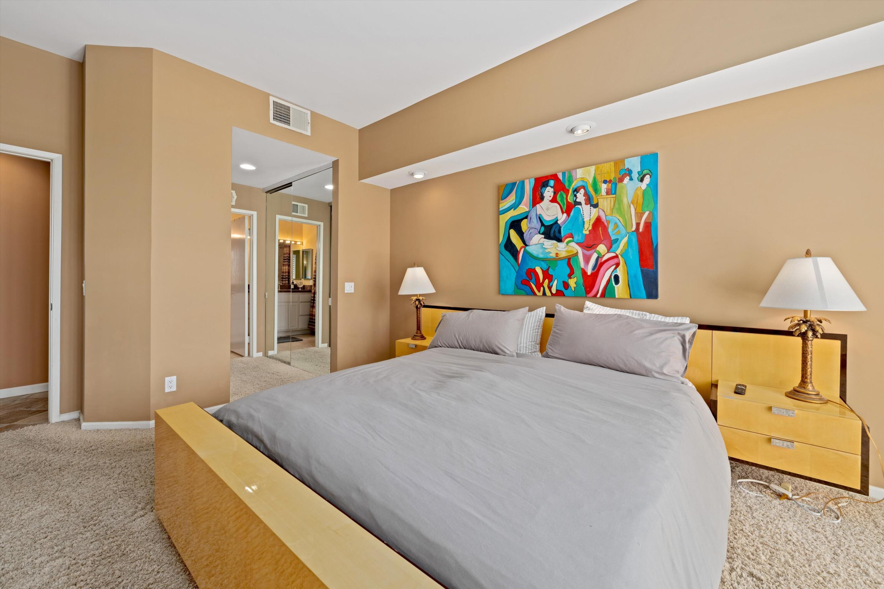 54053 Oak-Hill La Quinta, CA 92253 - Photo 16 of 36 a bed room with a bed and a couch