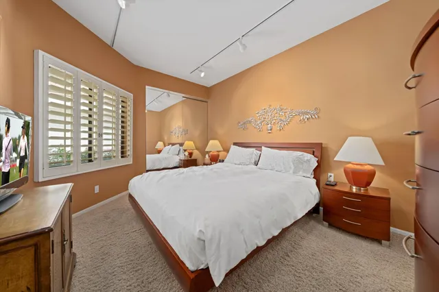 a bed room with a bed and a couch