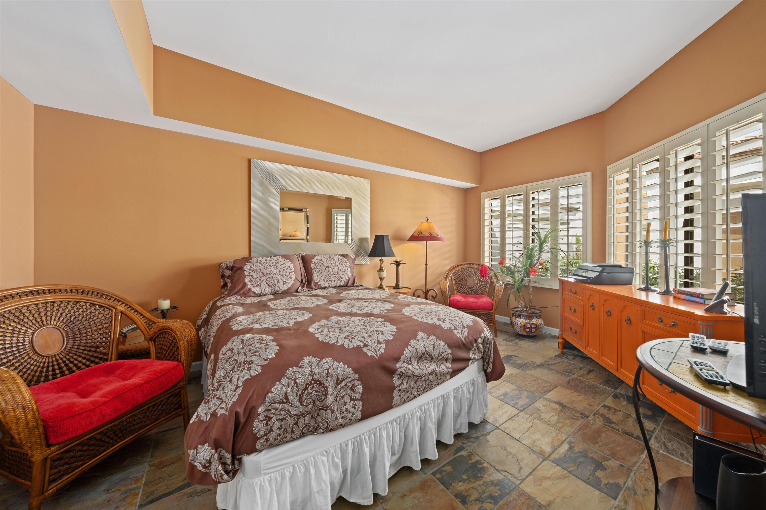 54053 Oak-Hill La Quinta, CA 92253 - Photo 22 of 36 a bed room with a bed and a couch