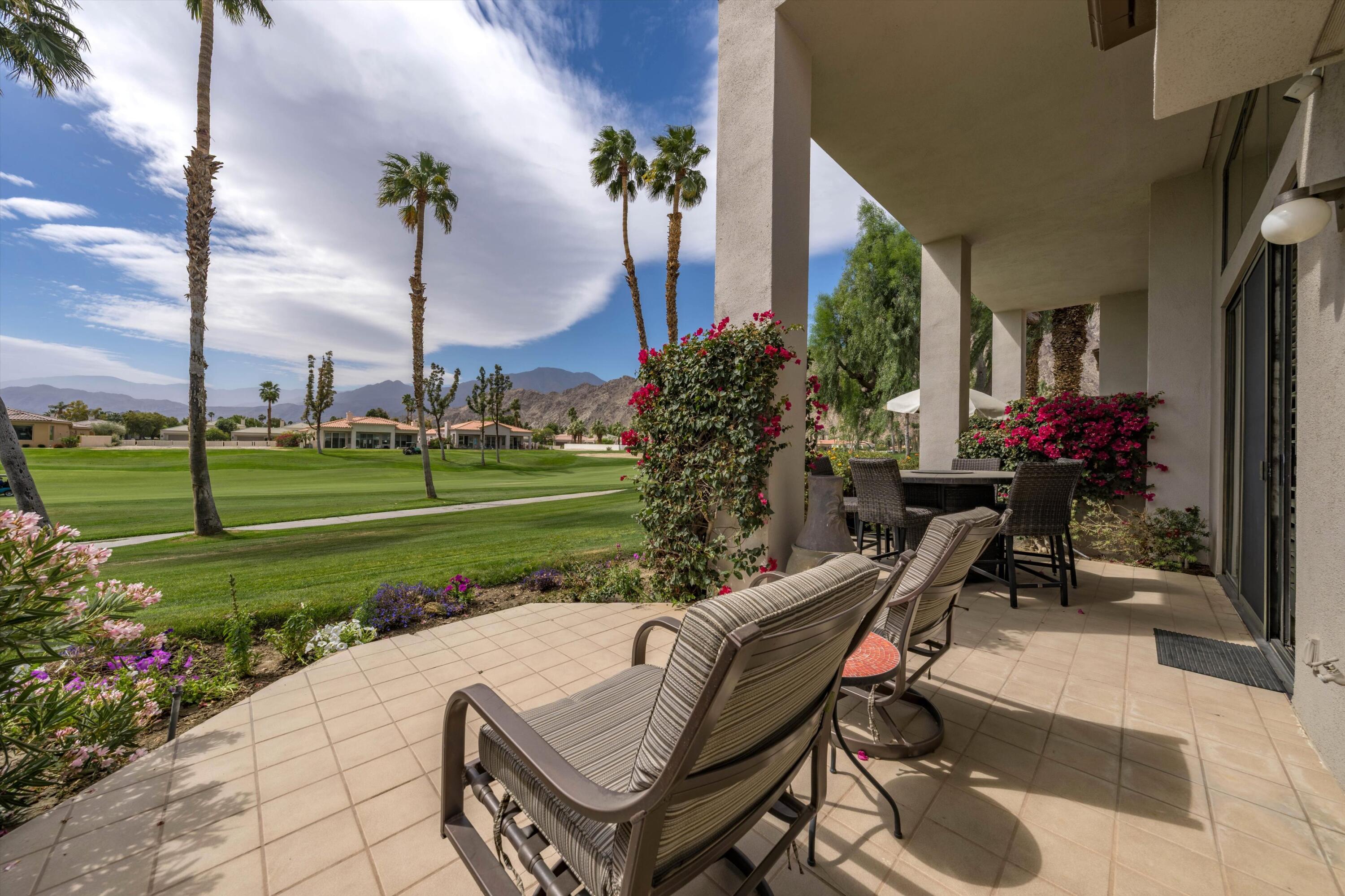 54053 Oak-Hill La Quinta, CA 92253 - Photo 24 of 36 a view of a house with backyard and sitting area
