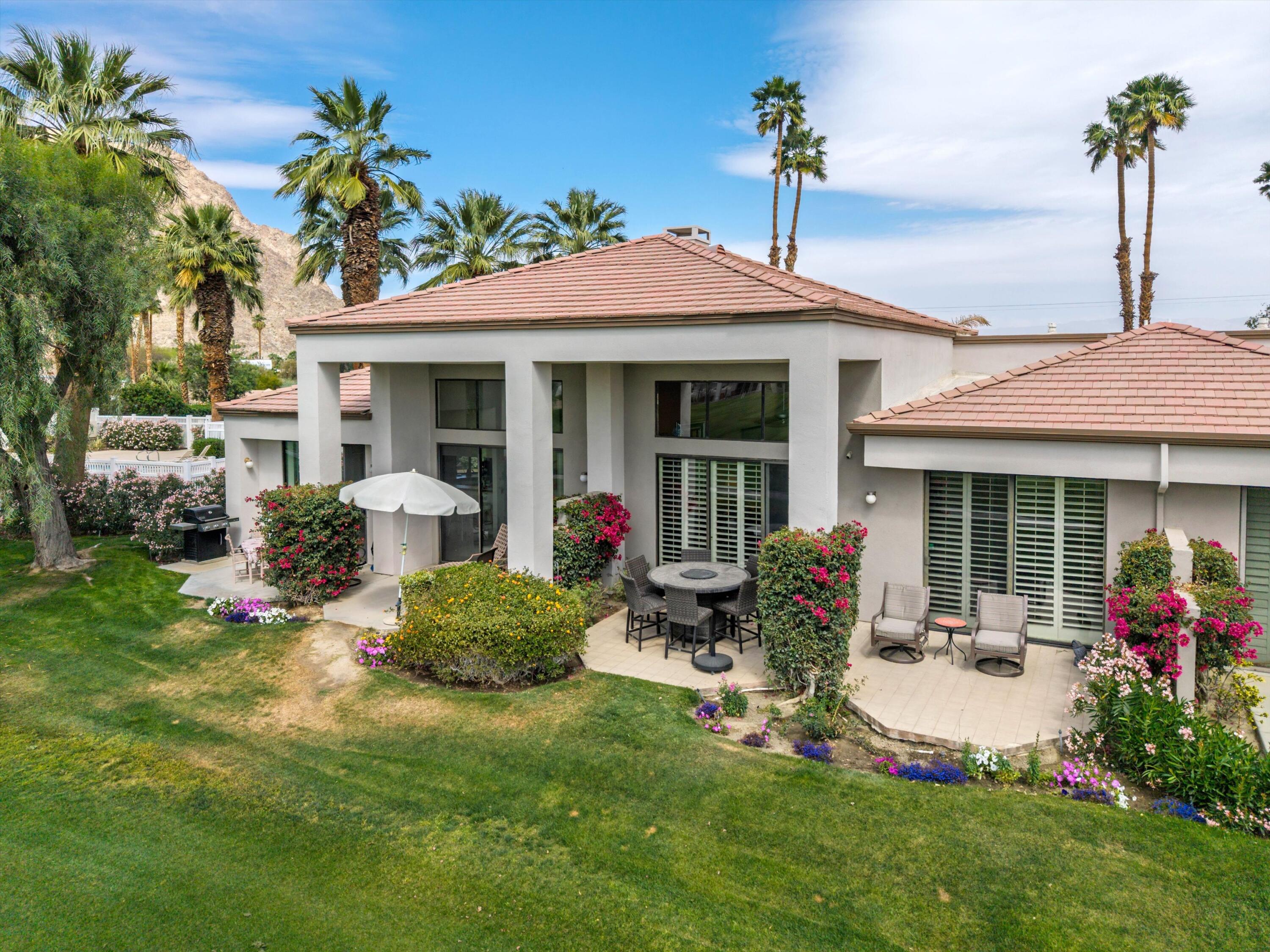 54053 Oak-Hill La Quinta, CA 92253 - Photo 28 of 36 a front view of a house with a yard