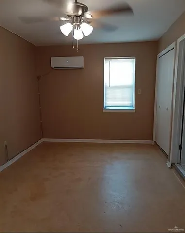 a view of a room with a hanging light