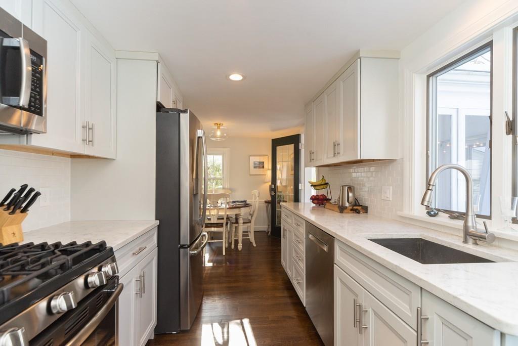 6 Dartmouth Road Marblehead, MA 01945 - Photo 8 of 21 a kitchen with a sink stove top oven and cabinets
