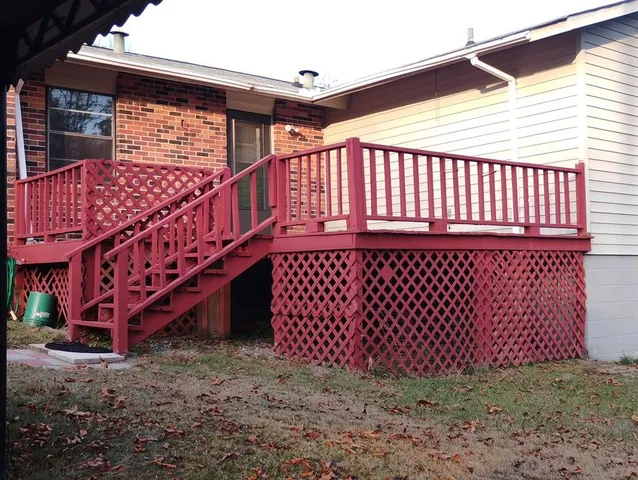 a view of a backyard with a deck