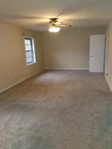 a view of empty room with windows