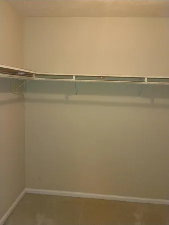 a view of an empty walk in closet